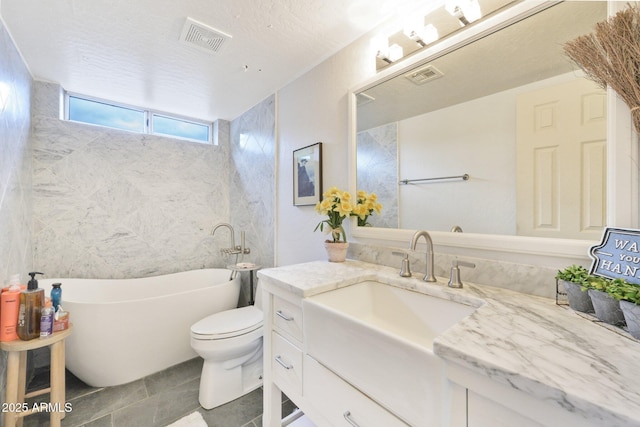 full bath with a soaking tub, vanity, and toilet