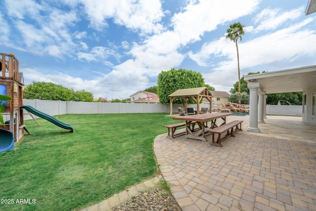 view of yard with a gazebo, a patio area, and a playground