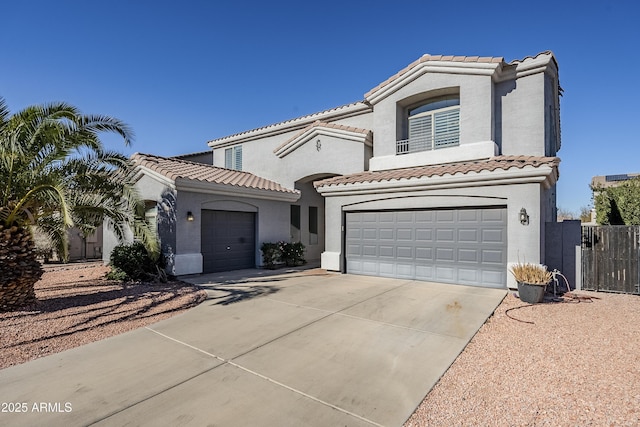 mediterranean / spanish-style home with a garage