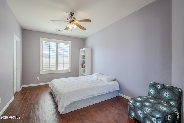 bedroom featuring ceiling fan and dark hardwood / wood-style flooring