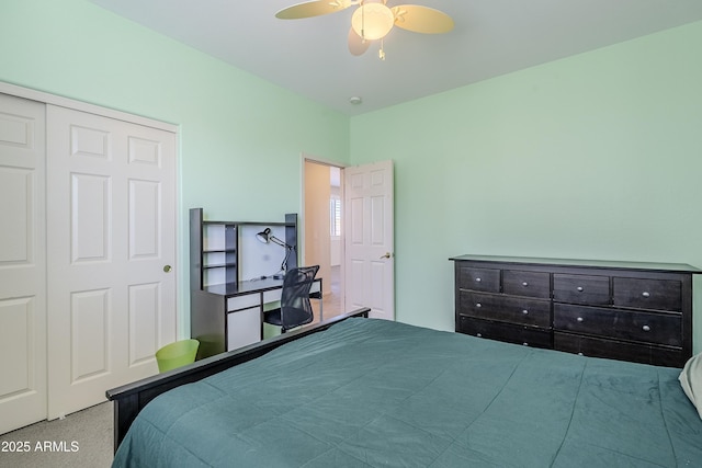 carpeted bedroom with a closet and ceiling fan