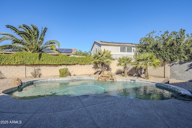 view of swimming pool with pool water feature