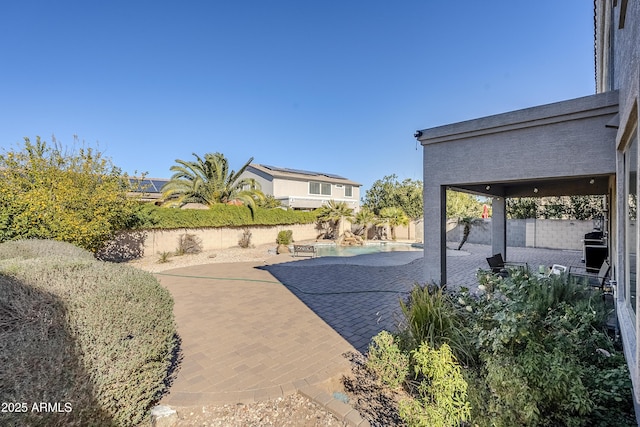 view of patio / terrace featuring a swimming pool