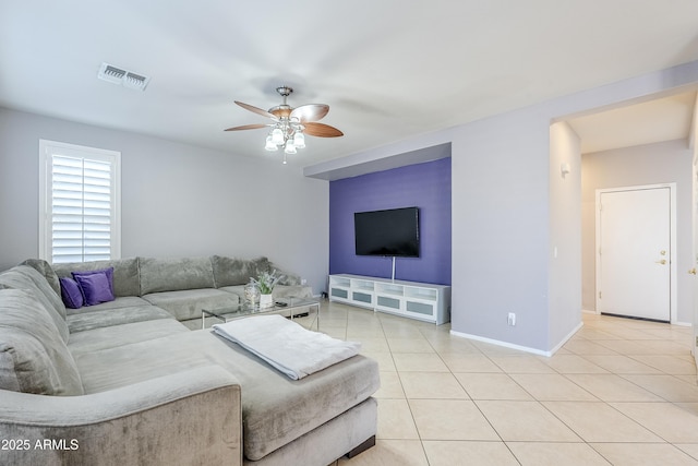 living room with ceiling fan and light tile patterned flooring