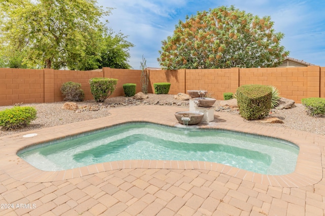 26234 W Behrend Dr, Buckeye, AZ 85396 - view of pool with a patio area and a fenced backyard