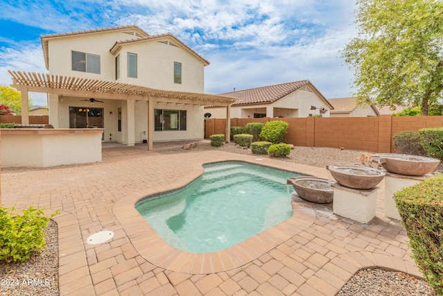 26234 W Behrend Dr, Buckeye, AZ 85396 - view of pool featuring a fenced in pool, a fenced backyard, outdoor dry bar, a ceiling fan, and a patio
