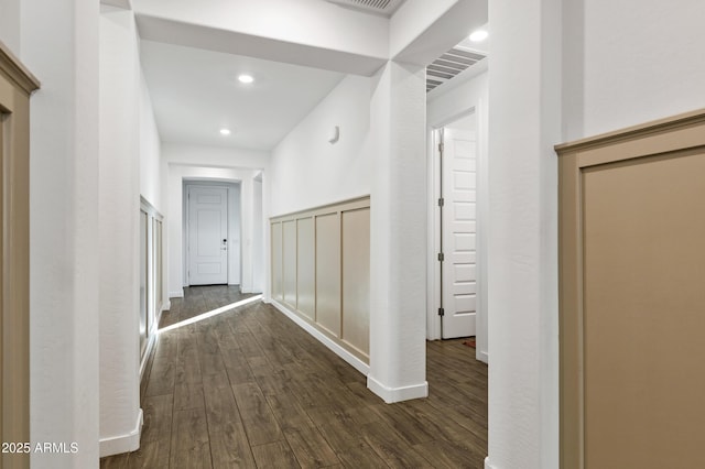 hallway with dark wood-style flooring, recessed lighting, and baseboards