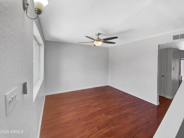 1750 E Mateo Cir Unit 103, Mesa, AZ 85204 - spare room with a ceiling fan and wood finished floors