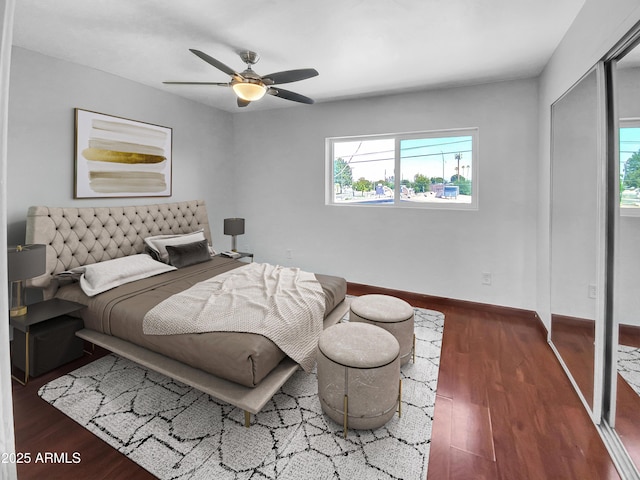 1750 E Mateo Cir Unit 103, Mesa, AZ 85204 - bedroom with multiple windows, wood finished floors, and ceiling fan