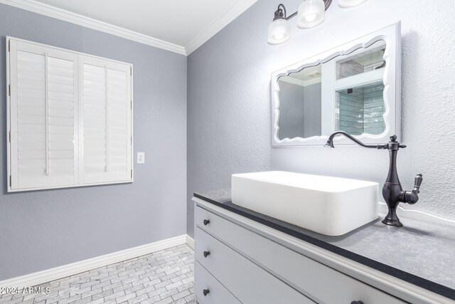 bathroom featuring vanity, tile patterned floors, and crown molding