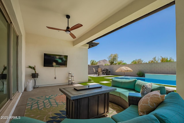 view of patio / terrace with an outdoor living space, a ceiling fan, a fenced backyard, and outdoor dining space