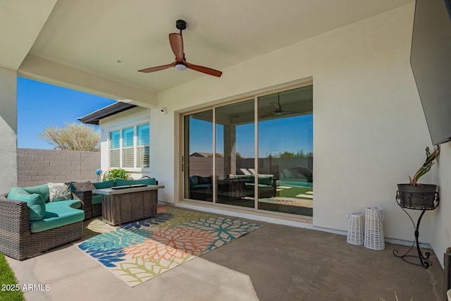 view of patio / terrace with outdoor lounge area, a fenced backyard, and a ceiling fan