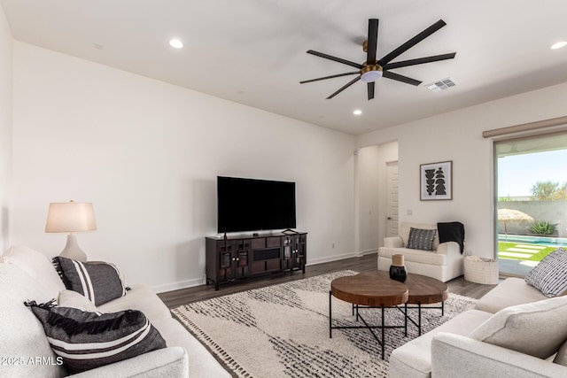 living area with ceiling fan, wood finished floors, recessed lighting, and baseboards
