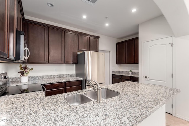 kitchen with visible vents, a sink, recessed lighting, stainless steel appliances, and dark brown cabinetry