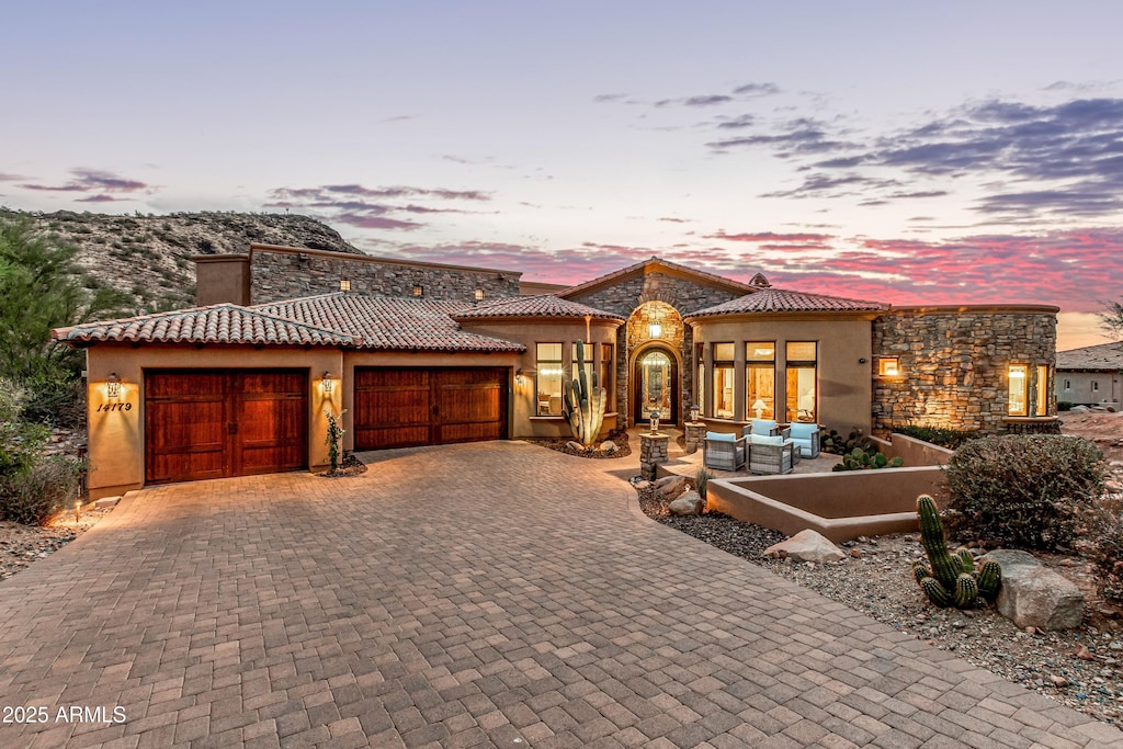 view of front of property with a garage