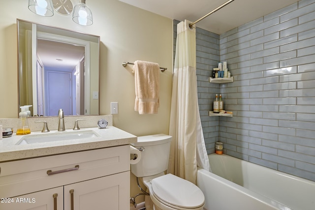 full bathroom featuring vanity, shower / tub combo with curtain, and toilet