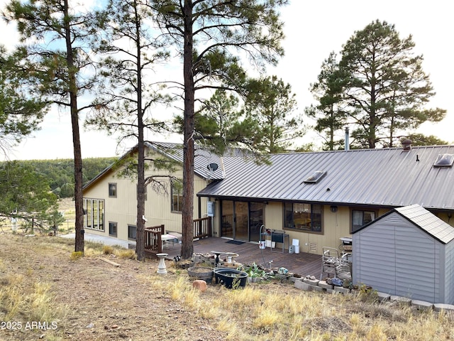 5408 Corda Ln, Show Low, AZ 85901 - rear view of property with a storage shed, an outdoor structure, a deck, and metal roof