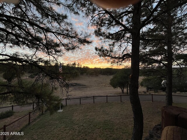 5408 Corda Ln, Show Low, AZ 85901 - yard at dusk featuring fence