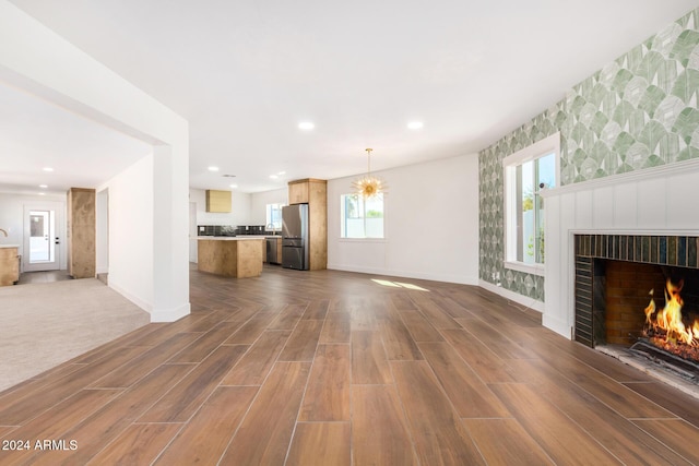 unfurnished living room featuring dark hardwood / wood-style floors