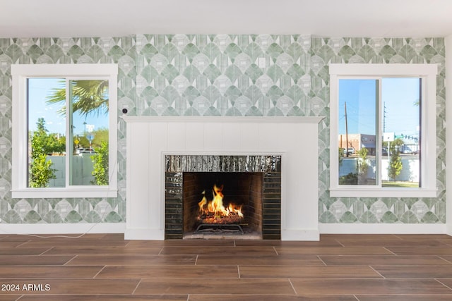 room details featuring a fireplace and hardwood / wood-style flooring