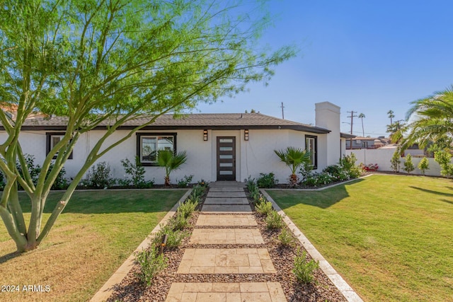 view of front of house with a front yard