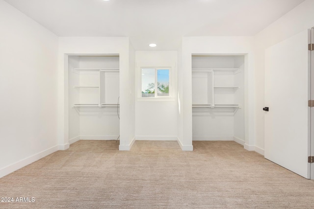 unfurnished bedroom with light carpet