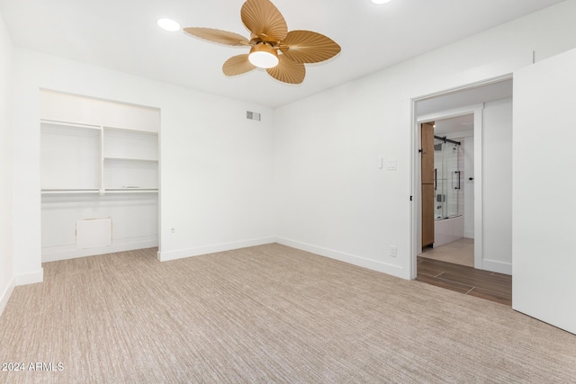 unfurnished bedroom featuring light hardwood / wood-style floors, a closet, and ceiling fan