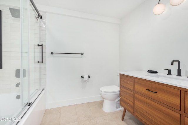 full bathroom with vanity, toilet, and bath / shower combo with glass door