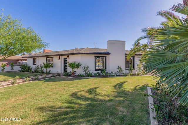 view of front of property with a front lawn