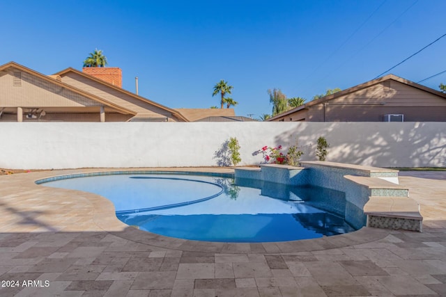 view of swimming pool with a patio