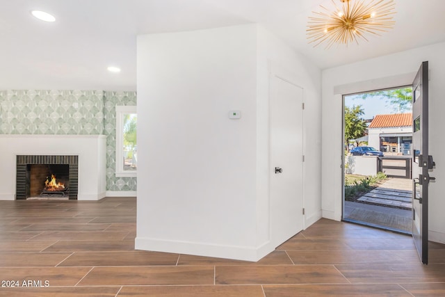 entrance foyer featuring dark hardwood / wood-style floors and a healthy amount of sunlight