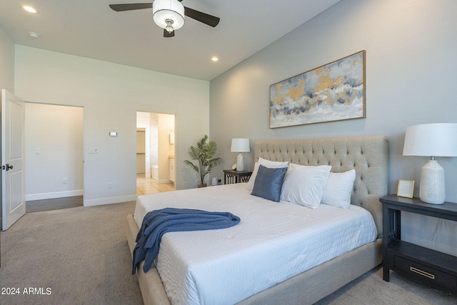 carpeted bedroom featuring ceiling fan and connected bathroom