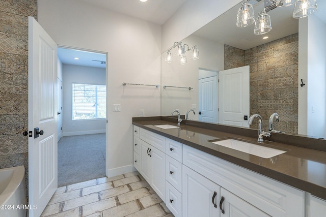 bathroom featuring a bathtub and vanity