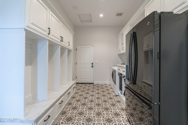 mudroom with washing machine and clothes dryer