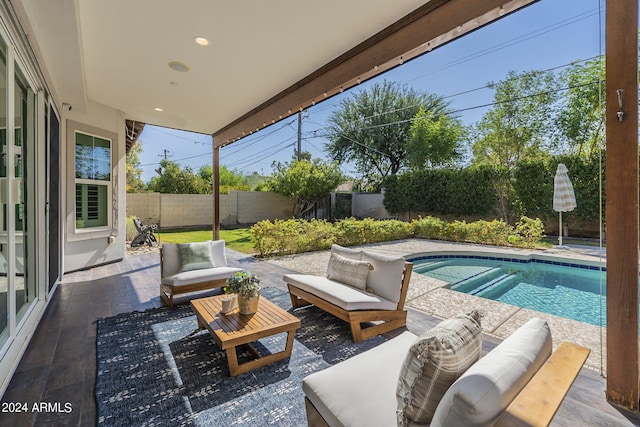 view of pool featuring outdoor lounge area and a patio area