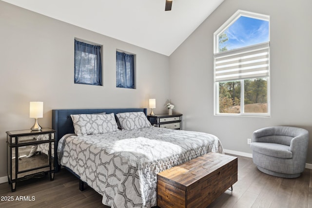 bedroom featuring hardwood / wood-style floors and vaulted ceiling