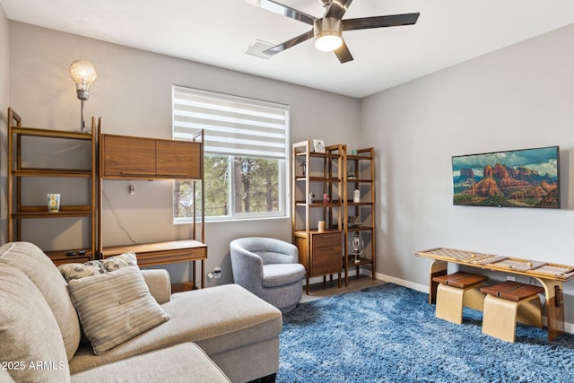 interior space with ceiling fan