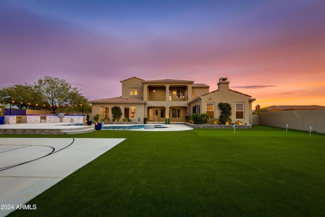 exterior space with a lawn and a patio area