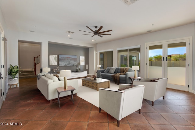 tiled living room with ceiling fan