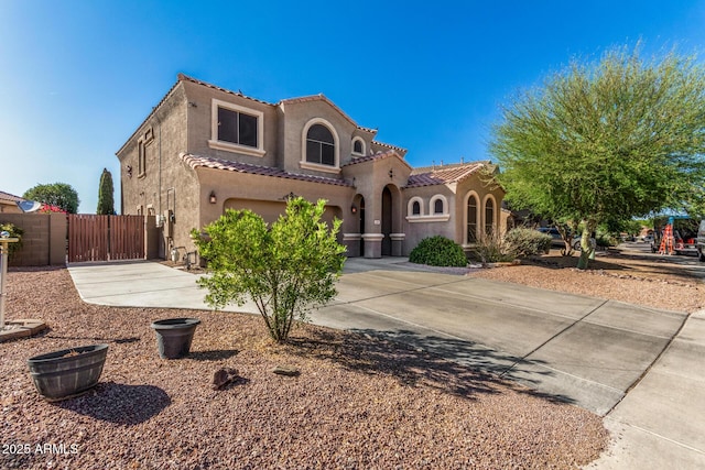 654 E Taylor Trl, San Tan Valley, AZ 85143 - mediterranean / spanish-style house featuring a gate, stucco siding, a garage, driveway, and a tile roof