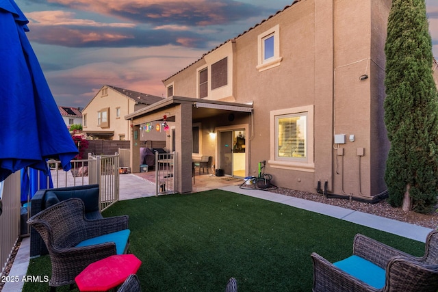 654 E Taylor Trl, San Tan Valley, AZ 85143 - back of house featuring stucco siding and a patio area