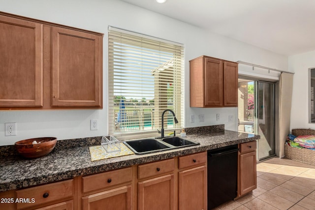 654 E Taylor Trl, San Tan Valley, AZ 85143 - kitchen featuring black dishwasher, a sink, dark countertops, and light tile patterned floors