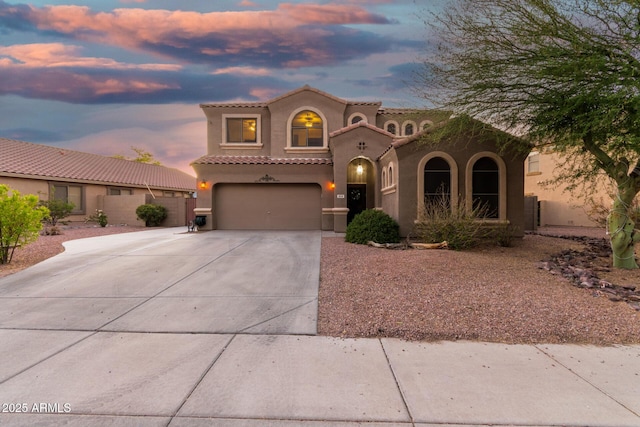 654 E Taylor Trl, San Tan Valley, AZ 85143 - mediterranean / spanish-style home featuring stucco siding, driveway, a garage, and a tiled roof