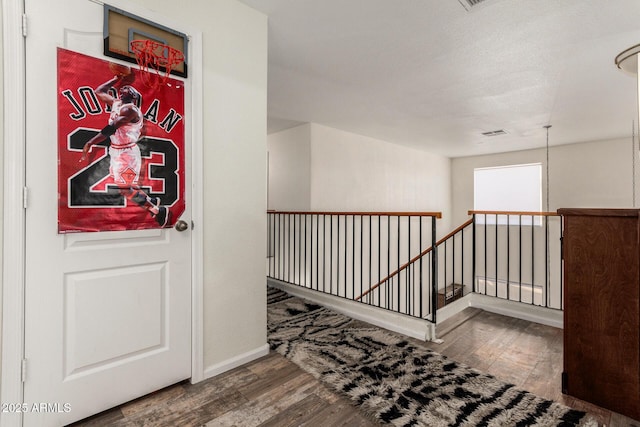 654 E Taylor Trl, San Tan Valley, AZ 85143 - hall featuring an upstairs landing, wood finished floors, and baseboards