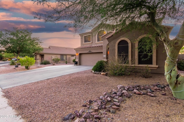 654 E Taylor Trl, San Tan Valley, AZ 85143 - mediterranean / spanish house with driveway, a garage, a tiled roof, and stucco siding