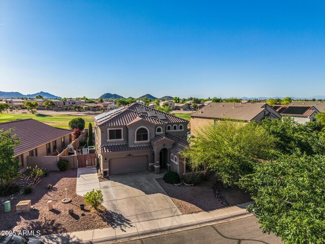 654 E Taylor Trl, San Tan Valley, AZ 85143 - view of front of home with driveway, a garage, a residential view, a tiled roof, and stucco siding
