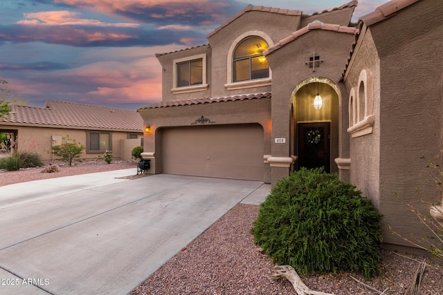 654 E Taylor Trl, San Tan Valley, AZ 85143 - mediterranean / spanish house featuring stucco siding, concrete driveway, a garage, and a tiled roof