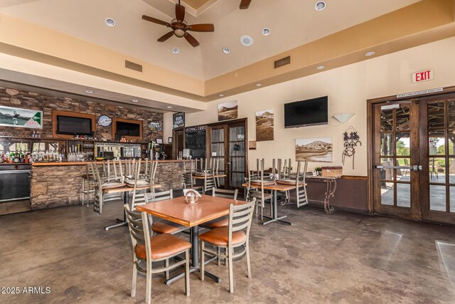 654 E Taylor Trl, San Tan Valley, AZ 85143 - dining space featuring ceiling fan, finished concrete flooring, french doors, a high ceiling, and recessed lighting
