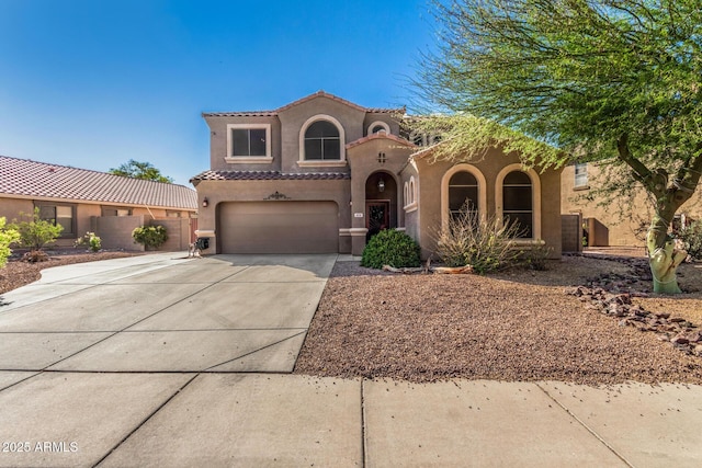 654 E Taylor Trl, San Tan Valley, AZ 85143 - mediterranean / spanish house with stucco siding, concrete driveway, and a garage