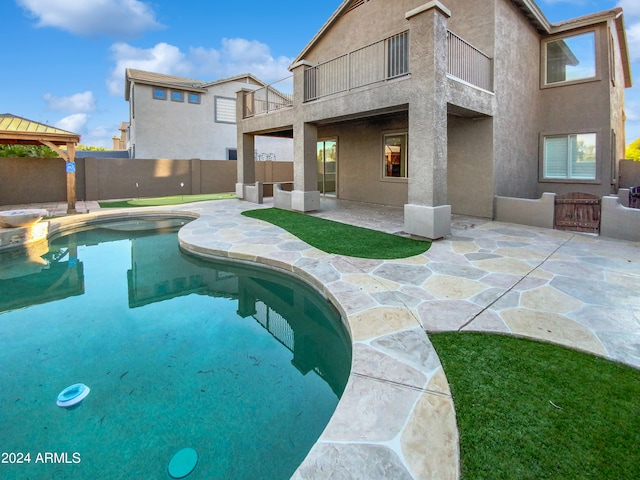 view of pool featuring a gazebo and a patio